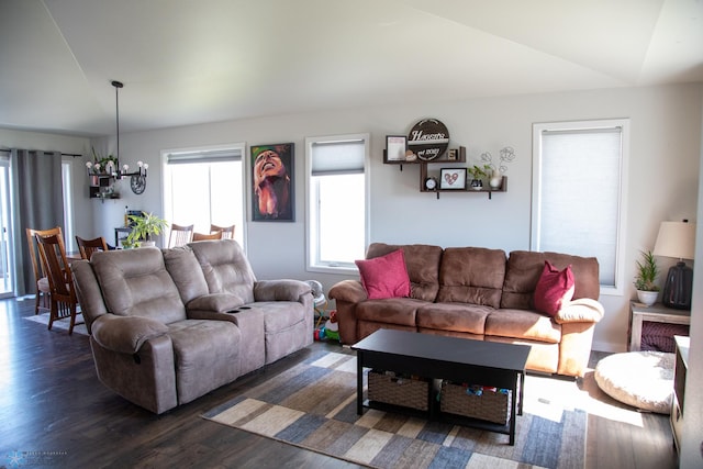 2700 14th St W, West Fargo, ND 58078 - living area featuring vaulted ceiling, a chandelier, and dark wood-type flooring