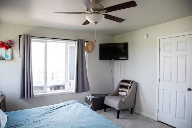 2700 14th St W, West Fargo, ND 58078 - bedroom with carpet floors, multiple windows, a ceiling fan, and baseboards