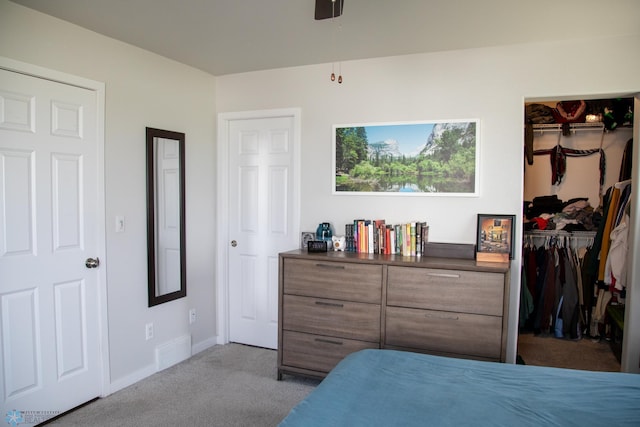 2700 14th St W, West Fargo, ND 58078 - bedroom with carpet, a walk in closet, a closet, and baseboards