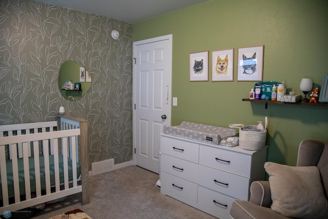 2700 14th St W, West Fargo, ND 58078 - carpeted bedroom with wallpapered walls and a crib