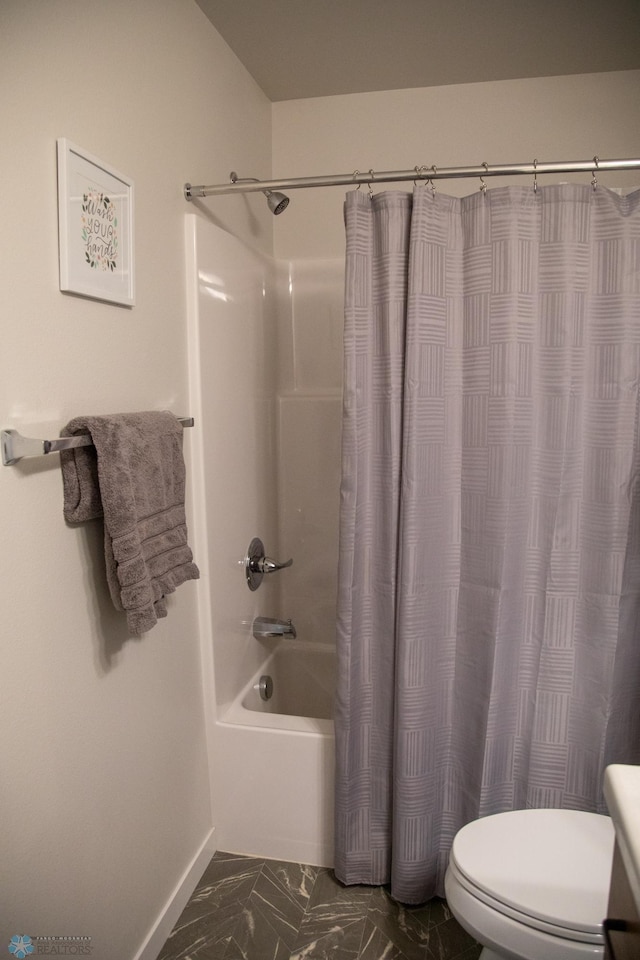 2700 14th St W, West Fargo, ND 58078 - bathroom featuring shower / bath combo with shower curtain, toilet, baseboards, marble look tiles, and vanity