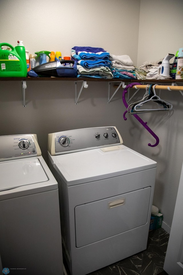 2700 14th St W, West Fargo, ND 58078 - laundry room with washing machine and clothes dryer and dark marble finish flooring