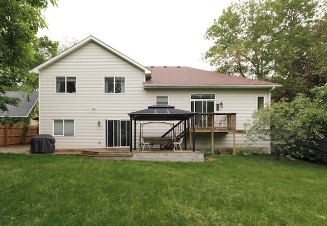 1712 Levee Ave, Anoka, MN 55303 - rear view of house featuring a gazebo, a patio area, roof with shingles, and a wooden deck