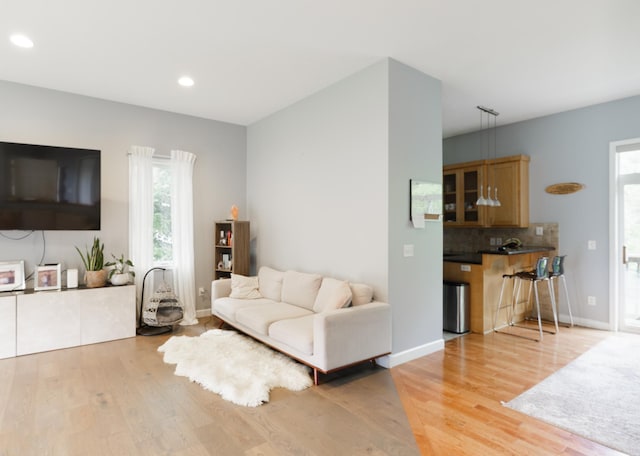 1712 Levee Ave, Anoka, MN 55303 - living area featuring light wood-type flooring, plenty of natural light, recessed lighting, and baseboards