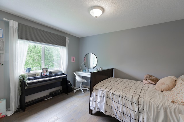 1712 Levee Ave, Anoka, MN 55303 - bedroom featuring hardwood / wood-style flooring and a textured ceiling