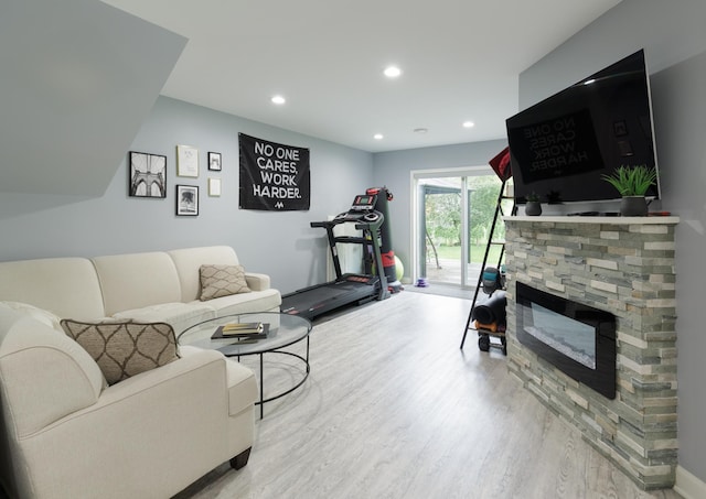 1712 Levee Ave, Anoka, MN 55303 - living area with light wood finished floors, recessed lighting, and a fireplace