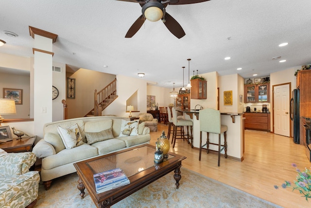 14518 Florissant Path Unit 3090, Apple Valley, MN 55124 - living room with a ceiling fan, light wood-style flooring, stairway, a textured ceiling, and recessed lighting