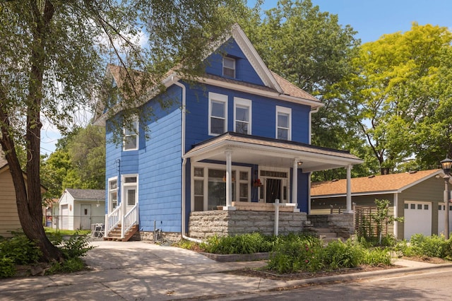 159 Western Ave S, Saint Paul, MN 55102 - american foursquare style home featuring covered porch, concrete driveway, and a garage