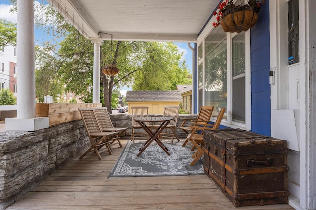 159 Western Ave S, Saint Paul, MN 55102 - wooden terrace featuring outdoor dining area and an outdoor structure