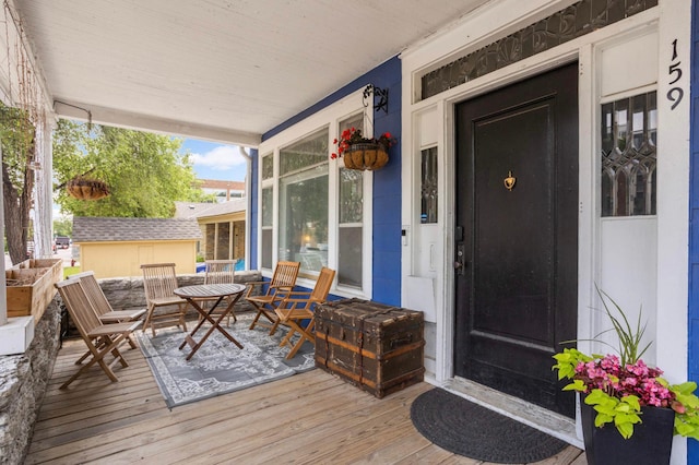159 Western Ave S, Saint Paul, MN 55102 - wooden porch featuring outdoor dining space