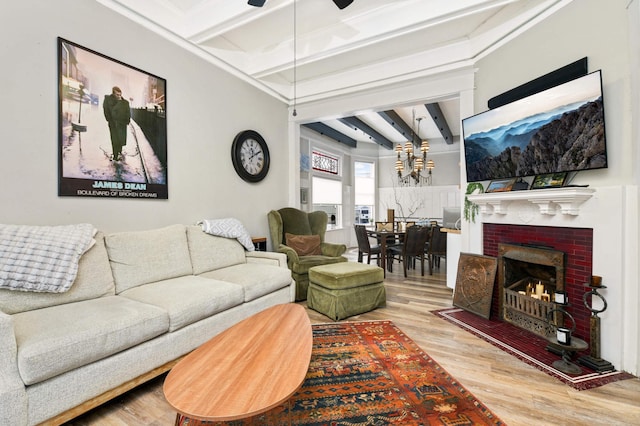 159 Western Ave S, Saint Paul, MN 55102 - living area featuring beam ceiling, wood finished floors, a chandelier, a brick fireplace, and a ceiling fan