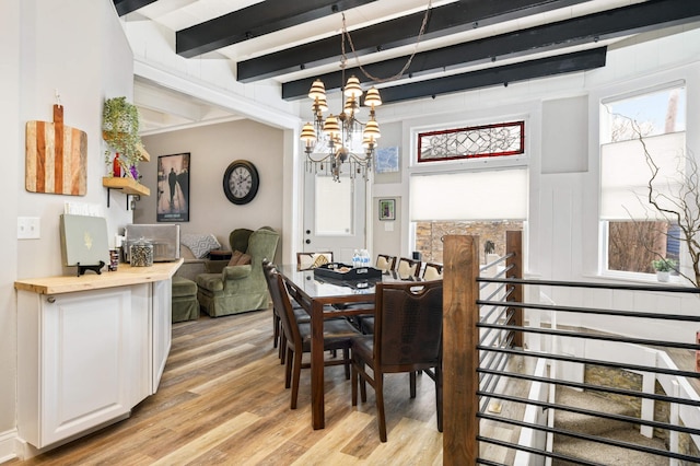 159 Western Ave S, Saint Paul, MN 55102 - dining area with light wood finished floors, a chandelier, and beam ceiling