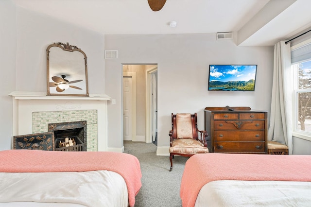 159 Western Ave S, Saint Paul, MN 55102 - carpeted bedroom featuring a tiled fireplace and a ceiling fan