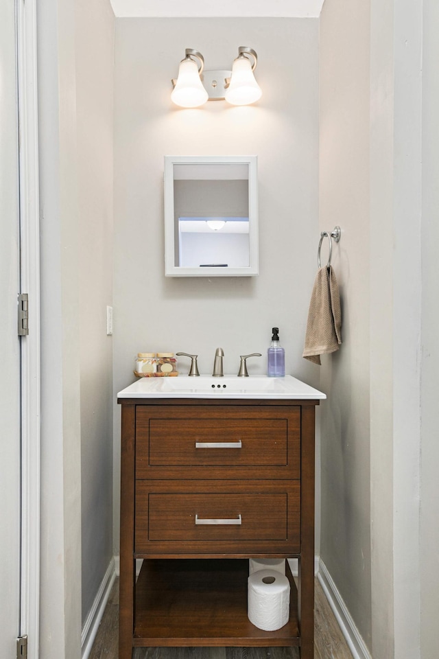 159 Western Ave S, Saint Paul, MN 55102 - bathroom with vanity and wood finished floors