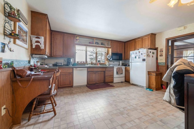 44655 Red Oak Rd, Staples, MN 56479 - kitchen with white appliances, healthy amount of natural light, brown cabinets, and a sink
