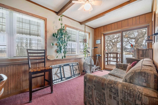 44655 Red Oak Rd, Staples, MN 56479 - carpeted living room featuring beamed ceiling, wood walls, ceiling fan, and cooling unit