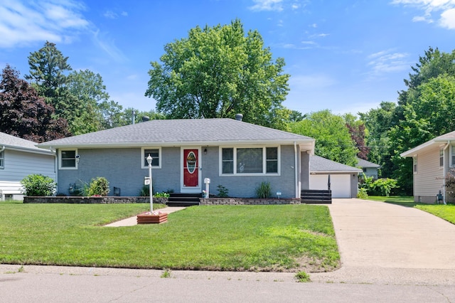 5019 Washington St NE, Columbia Heights, MN 55421 - single story home with a detached garage, a front yard, brick siding, entry steps, and roof with shingles
