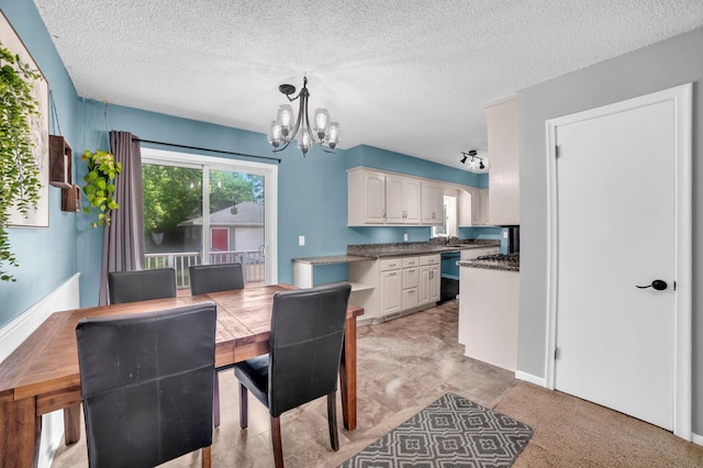 5019 Washington St NE, Columbia Heights, MN 55421 - dining space featuring a chandelier and a textured ceiling