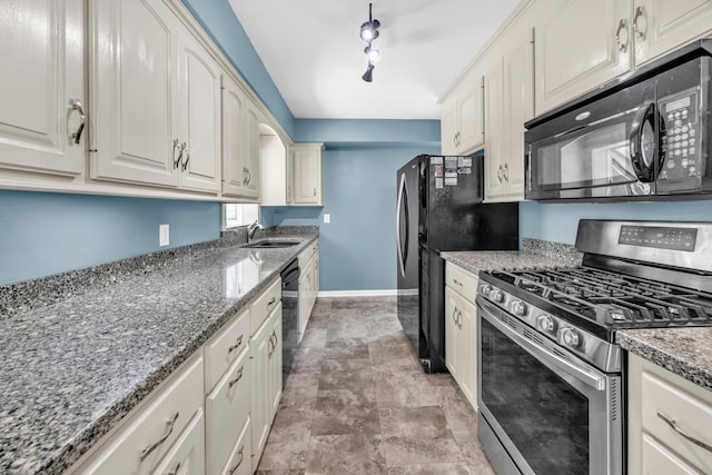 5019 Washington St NE, Columbia Heights, MN 55421 - kitchen featuring black appliances, white cabinetry, stone counters, and stone finish flooring
