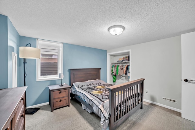 5019 Washington St NE, Columbia Heights, MN 55421 - bedroom with light carpet and a textured ceiling