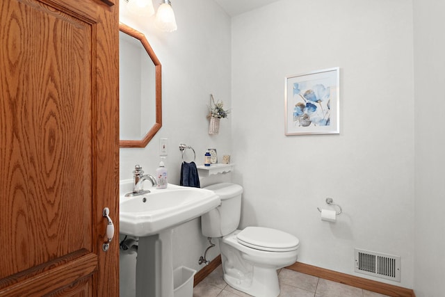 19260 81st Pl N, Maple Grove, MN 55311 - bathroom featuring tile patterned flooring, toilet, and baseboards