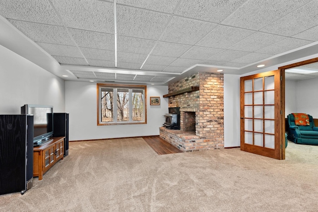 19260 81st Pl N, Maple Grove, MN 55311 - unfurnished living room with carpet floors, baseboards, a fireplace, a paneled ceiling, and recessed lighting