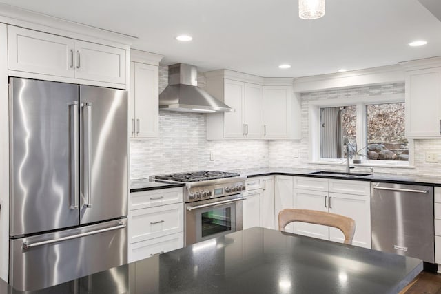 3715 Huntingdon Dr, Minnetonka, MN 55305 - kitchen featuring high end appliances, wall chimney exhaust hood, a sink, white cabinetry, and decorative backsplash