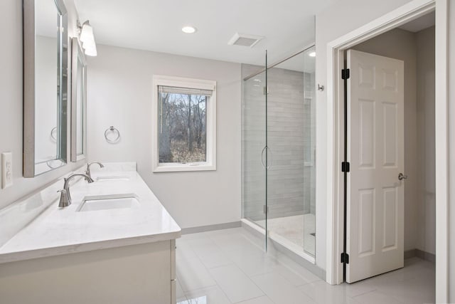 3715 Huntingdon Dr, Minnetonka, MN 55305 - full bathroom featuring double vanity, tile patterned flooring, a stall shower, recessed lighting, and baseboards