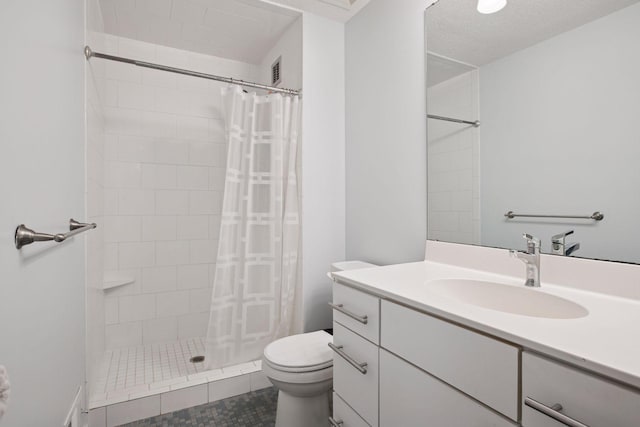 3715 Huntingdon Dr, Minnetonka, MN 55305 - bathroom featuring toilet, vanity, tiled shower, and tile patterned flooring