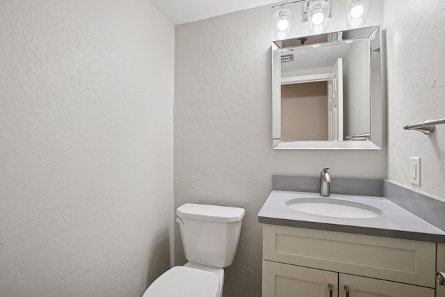 3715 Huntingdon Dr, Minnetonka, MN 55305 - half bathroom featuring toilet, vanity, and a textured wall