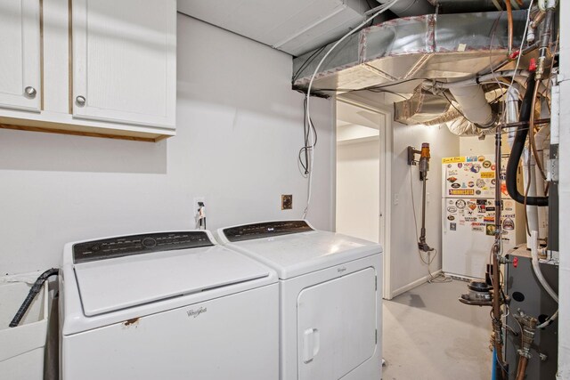 3715 Huntingdon Dr, Minnetonka, MN 55305 - washroom featuring cabinet space and washing machine and dryer