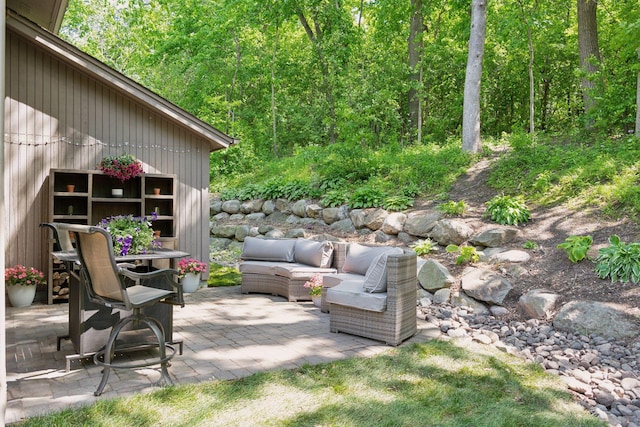 3715 Huntingdon Dr, Minnetonka, MN 55305 - view of patio featuring an outdoor living space and a wooded view