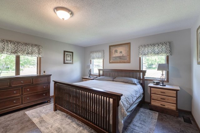 32 7th St, Buffalo City, WI 54622 - carpeted bedroom with a textured ceiling and baseboards
