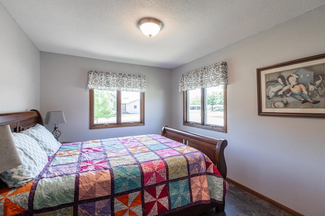 32 7th St, Buffalo City, WI 54622 - carpeted bedroom with multiple windows and a textured ceiling