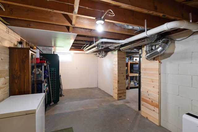 32 7th St, Buffalo City, WI 54622 - basement featuring refrigerator and concrete block wall