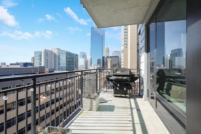 740 Portland Ave Unit 907, Minneapolis, MN 55415 - balcony featuring a skyline view and area for grilling
