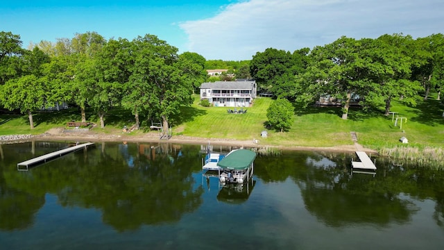 27668 Crappie Trl, Sverdrup Twp, MN 56586 - rear view of house featuring a water view and a lawn