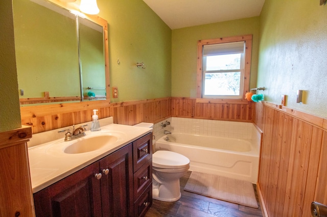 27668 Crappie Trl, Sverdrup Twp, MN 56586 - bathroom with wainscoting, wood walls, a garden tub, vanity, and toilet