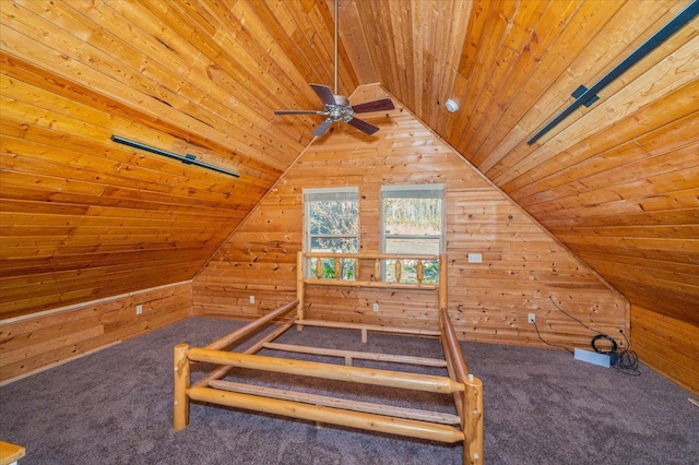 2331 Wilderness Rd, Lakeside Twp, WI 54864 - carpeted bedroom with wooden ceiling, wooden walls, and lofted ceiling