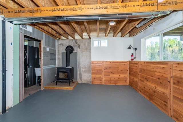 2331 Wilderness Rd, Lakeside Twp, WI 54864 - below grade area featuring a wood stove