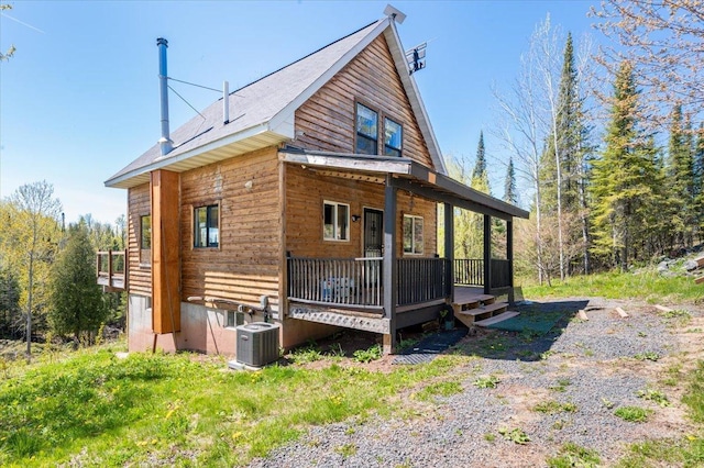 2331 Wilderness Rd, Lakeside Twp, WI 54864 - rear view of property featuring a porch and central air condition unit
