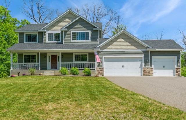 13284 288th Ave NW, Zimmerman, MN 55398 - view of front of house with a garage, asphalt driveway, a front yard, a shingled roof, and stone siding