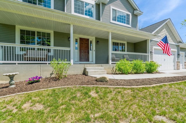 13284 288th Ave NW, Zimmerman, MN 55398 - view of front of house with covered porch and a garage