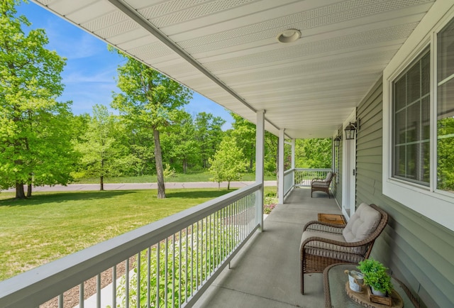 13284 288th Ave NW, Zimmerman, MN 55398 - covered porch with a yard and view of wooded area