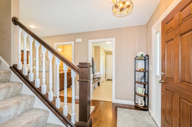 13284 288th Ave NW, Zimmerman, MN 55398 - entrance foyer featuring dark wood-style floors, stairs, and baseboards
