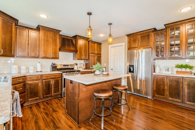 13284 288th Ave NW, Zimmerman, MN 55398 - kitchen with appliances with stainless steel finishes, custom range hood, dark wood-type flooring, light countertops, and recessed lighting