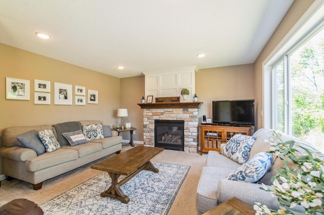 13284 288th Ave NW, Zimmerman, MN 55398 - living room featuring carpet floors, a stone fireplace, and recessed lighting
