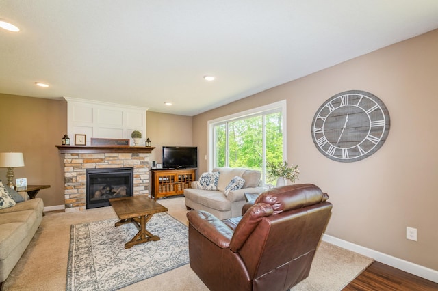 13284 288th Ave NW, Zimmerman, MN 55398 - living room featuring baseboards, a stone fireplace, recessed lighting, and wood finished floors