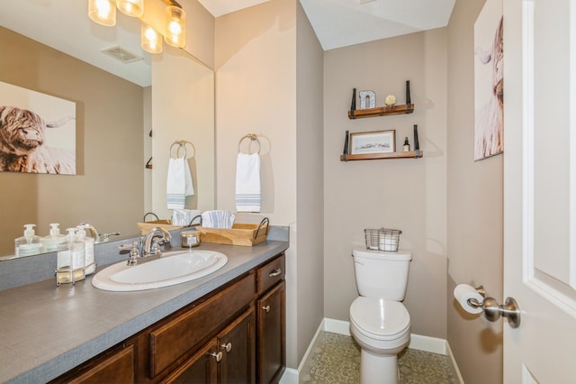 13284 288th Ave NW, Zimmerman, MN 55398 - bathroom with vanity, toilet, and baseboards