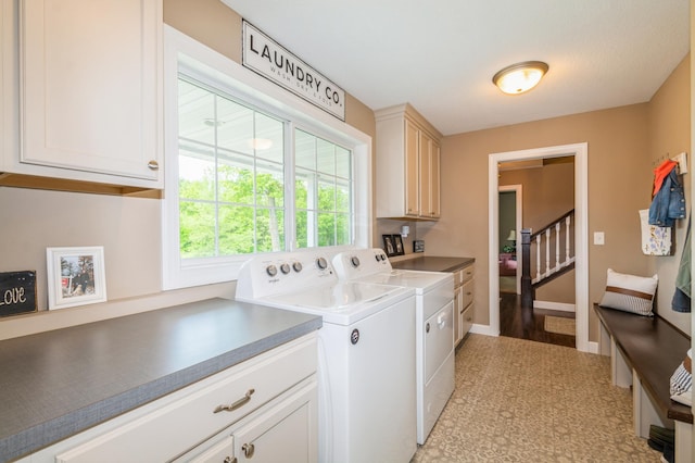 13284 288th Ave NW, Zimmerman, MN 55398 - laundry area with cabinet space, washer and dryer, and baseboards